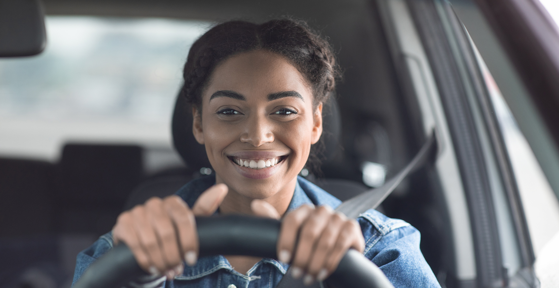 Happy customer smiling through newly installed windshield